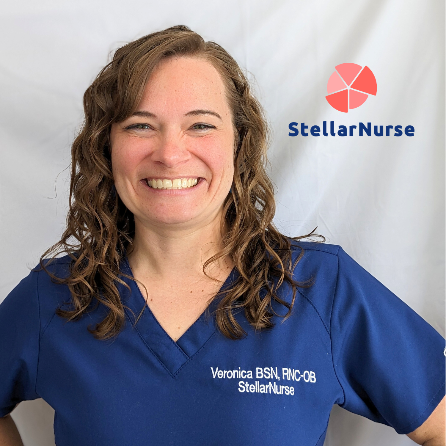 Smiling nurse in navy scrubs stands confidently in front of plain background with StellarNurse logo, promoting travel nurse support.